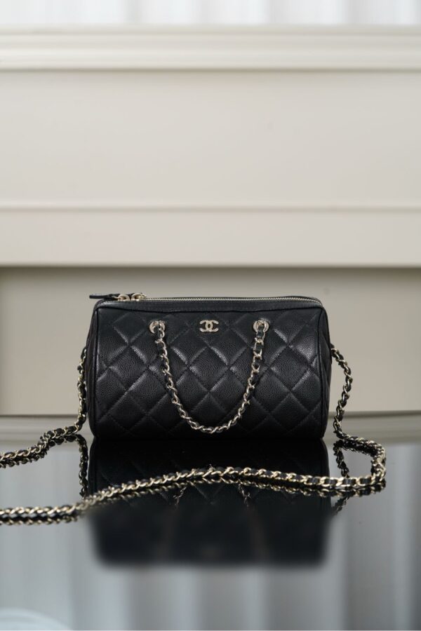 Chanel Boston bag with black and gold leather and chain, double pockets and layered design with a vintage feel
